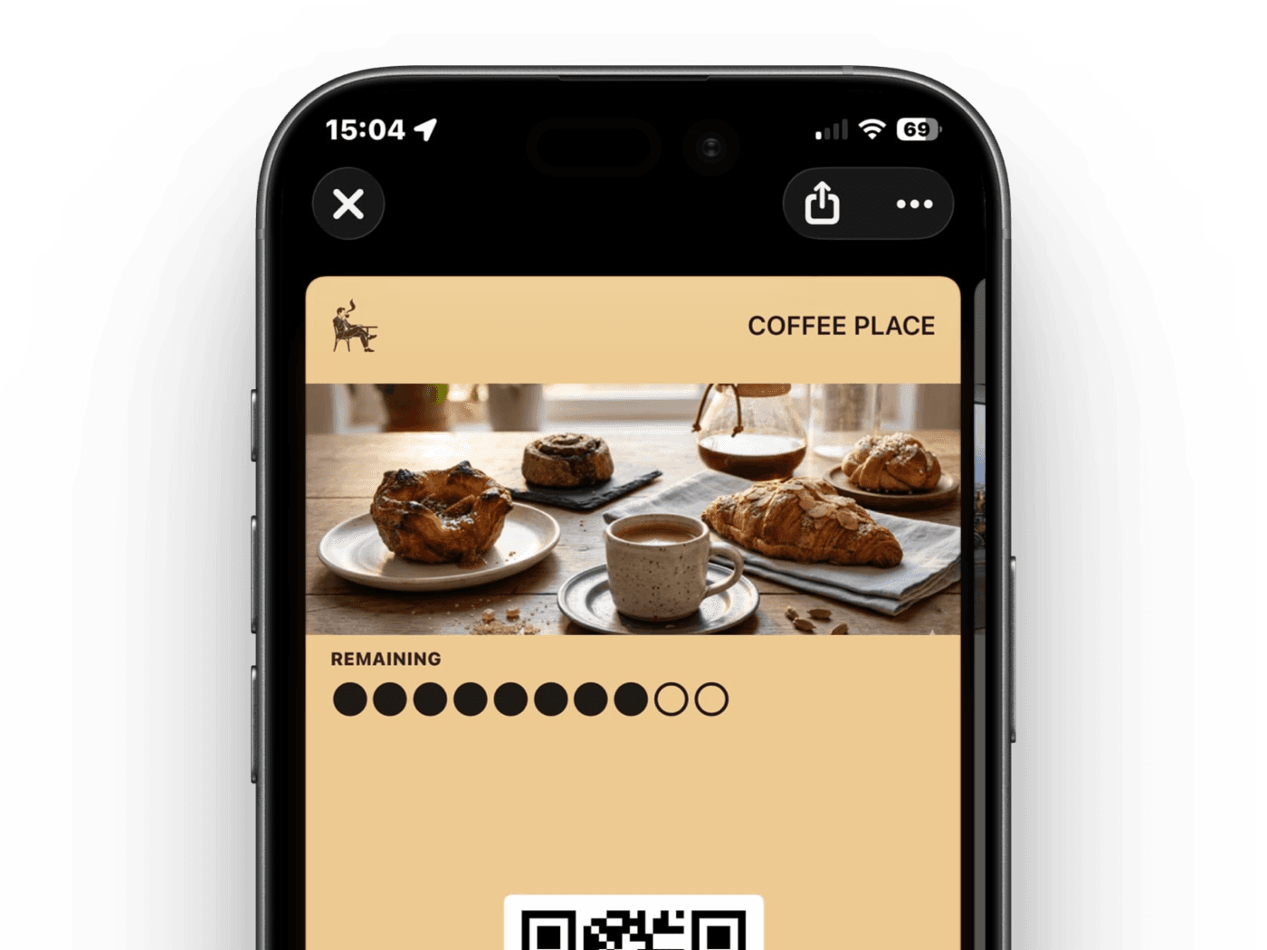 Um cartão de pacote de cafés na carteira do celular com os cafés restantes e um código para escanear
